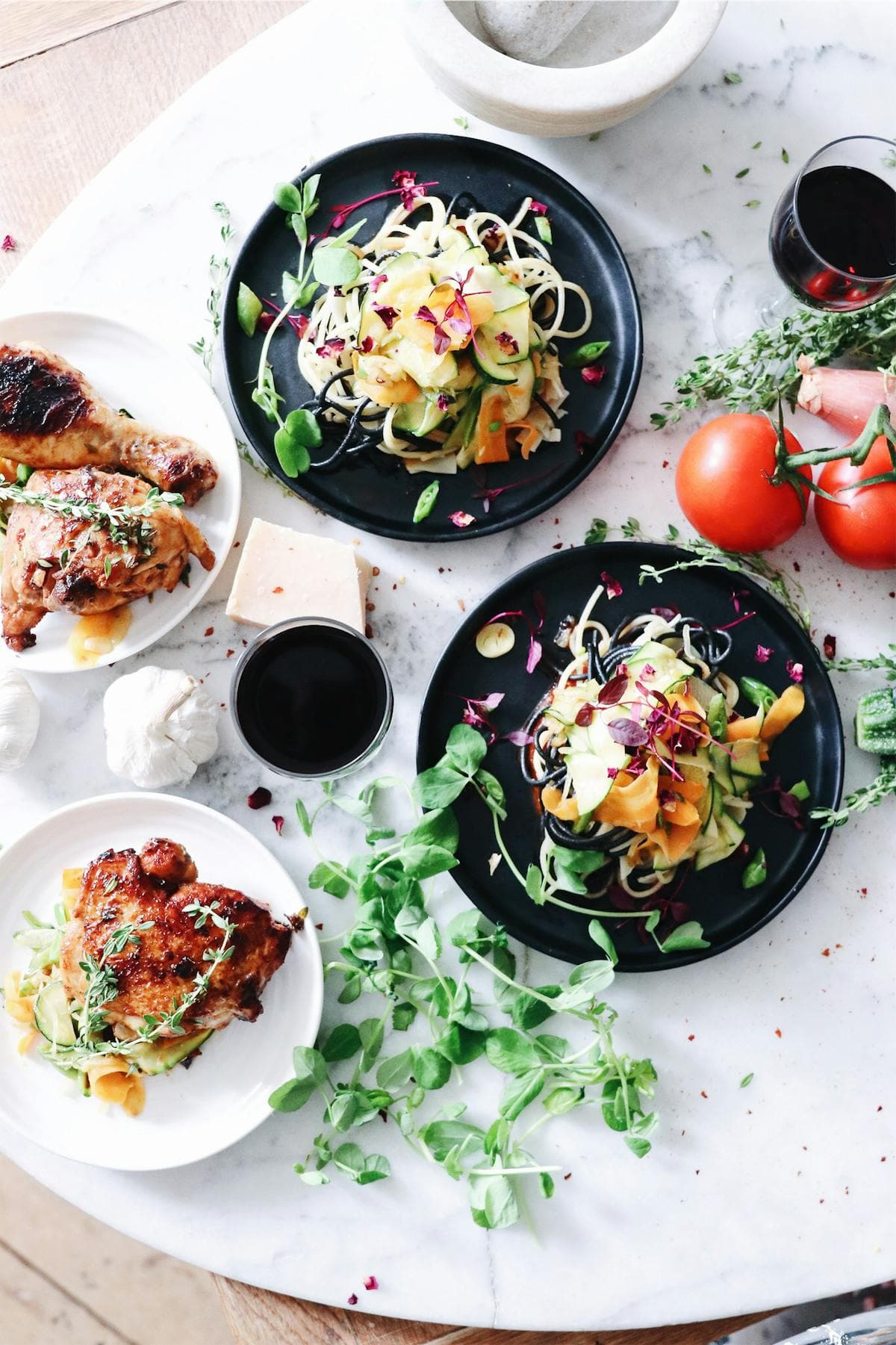 Variety of colorful dishes with fresh vegetables and herbs, showing a week of diverse meal planning